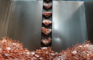 penny blanks on conveyor