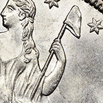 close up of liberty cap on a pole on the seated liberty half dollar obverse