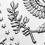 close up of olive branch on kennedy half dollar reverse