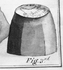 Drawing of a metal die with a design engraved on the top